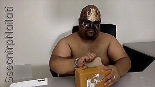 A brown man unboxing a new toy&period;