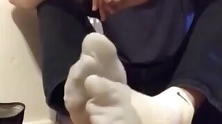 Rubbing my big, socked feet!