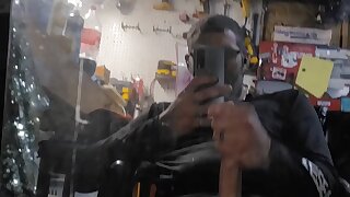 Man jerking off and busting a fat load on a mirror
