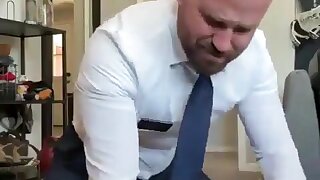 Guy fucking himself in a suit
