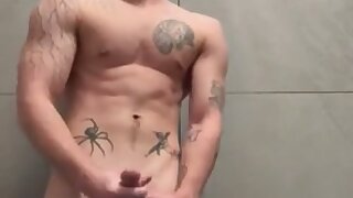 Blonde college stud jerks off in public bathroom and cums all over