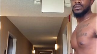 Hot Guy is taking hits clothes of stroking his hard Dick in the hotel hallway