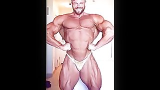 Eric Janicki flexing in gold posers