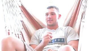 After his interview, the hunky guy reads a magazine and get horny once more