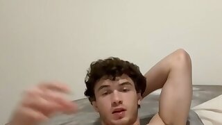 Sexy hunk masturbating in bed