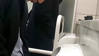 Twink male is pissing in the toilet porn
