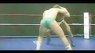 Two muscular men wrestling