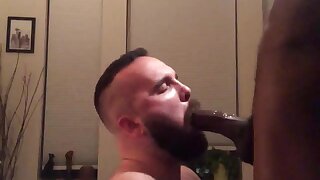 Muscular guy sucking big black dick