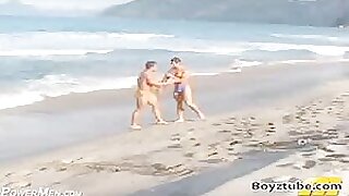 Bodybuilders beach wrestling