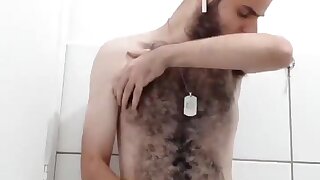 Young hairy guy jerking off in the shower