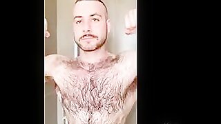 Muscled hairy dude teasing bushy pits 2
