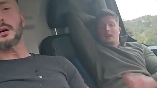 Friends in the delivery van during their lunch break.