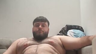 Chubby guy flexes his big uncut