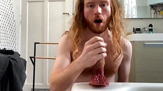 Hot ginger man has fun with a huge dildo